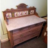 An Edwardian pine marble topped washstand,