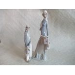 Two Lladro tall figures of ladies, one with a basket and the other with a deer at her side.