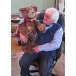 A large boxed Charlie Bear, wearing a grey and claret scarf and bearing the original labels.