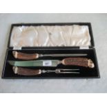A cased Mappin & Webb three piece carving set, each with antler handle.