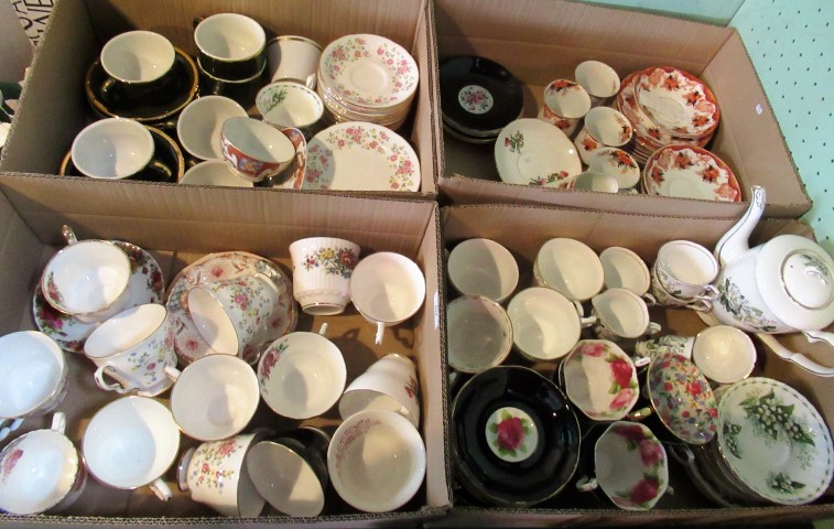 Four boxes of bone china and porcelain teawares.