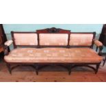 An early 19th century-style three person parlour settee,