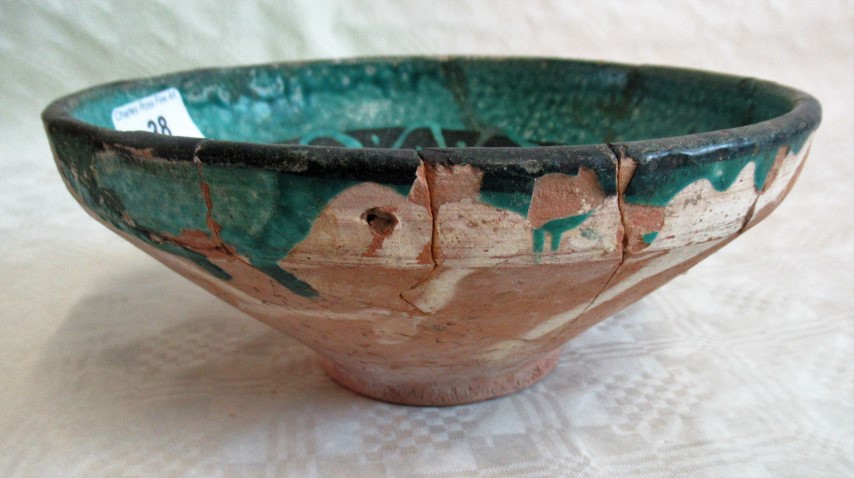 A Persian turquoise glazed fritware bowl, decorated with a running black band. - Image 2 of 3