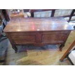 An 18th century-style Continental oak coffer, having a three planked top,