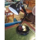 A vintage black Japanned industrial art machinist lamp with heavy swivel base.