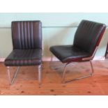 A pair of circa 1970's simulated rosewood and chrome lounge chairs,