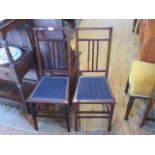 A pair of Edwardian mahogany and boxwood strung bedroom chairs.