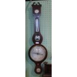 A mahogany and boxwood strung wheel barometer with dry/damp gauge and thermometer set to neck and
