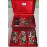 Of quantity of mixed silver and white metal jewellery in a two tier jewellery box.