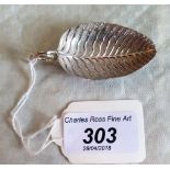 A late 18th century silver leaf form caddy spoon with tendril handle,