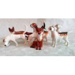 Five Beswick fox hounds and two foxes, each gloss glazed.