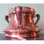 Three handled Newlyn-style Arts & Crafts copper tyg.