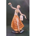 A late 19th/early 20th century Continental porcelain figure of an Art Deco dancing girl, 22cm.