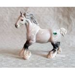 A Beswick model of a dapple grey heavy horse.