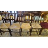 Four Edwardian rush seated dining chairs,