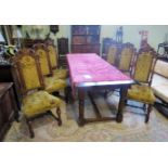 A set of six reproduction Carolean-style oak dining chairs,