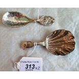 Two silver caddy spoons, to include: a Victorian silver broad shell moulded caddy spoon,