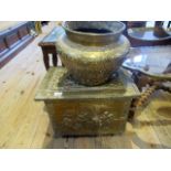 A Middle Eastern beaten brass jardiniere, together with a circa 1930's embossed brass coal box,