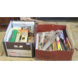 Two boxes of artist's requisites, including: oil paints, paint brushes, two easels, canvases,