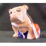 A Royal Doulton earthenware figure of a seated bulldog draped in a Union Jack, registered no.