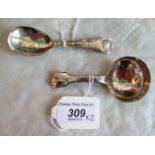 Two silver caddy spoons, to include: London 1828 by John,