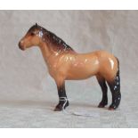A Beswick model of Highland pony, caramel and brown gloss glazed.