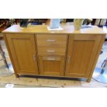 A contemporary beech veneered sideboard,