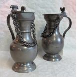 A 20th century Frauenfeld baluster pewter tankard with applied chain and acorn cast thumb piece to