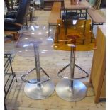 A Pam design Archirivolto amber tinted perspex bar stool with chrome foot rest and support,