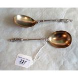 A pair of partial silver gilt apostle topped serving spoons by George Unite of Birmingham, 1885.