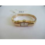 Baune & Mercier, a lady's 18ct gold bangle wristwatch,