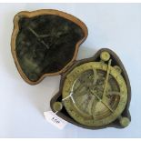 An 18th century-style brass marine compass in a hide covered outer case.