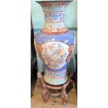 A 20th century Oriental floor vase, decorated with lotus blossoms and birds in a reserve,