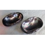 A pair of Georg Jensen design Danish silver oval dishes, with spot hammered and rose bud decoration,
