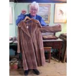 A three-quarter length lady's mink coat.