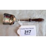 A George III silver scoop form caddy spoon with bright cut decoration and turned fruitwood handle,