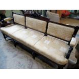 An early 19th century-style three person parlour settee,