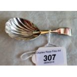 A Victorian silver shell form caddy spoon with fiddle pattern handle, London 1862,