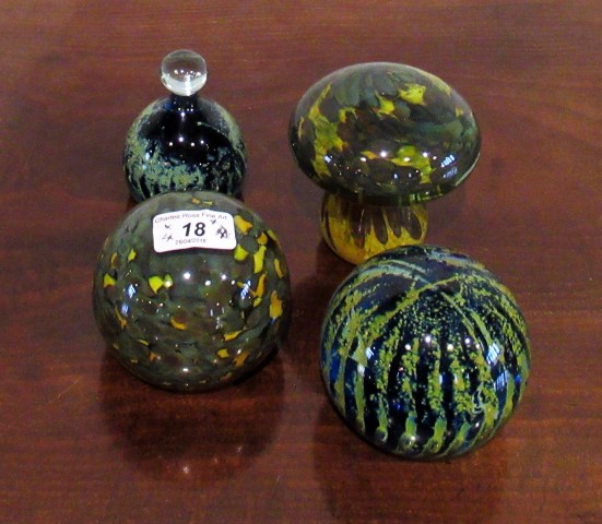 Four Mdina paperweights, one of mushroom form,