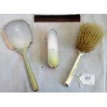 A silver four piece dressing table set, comprising: two brushes, hand mirror and comb,
