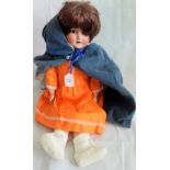 An early 20th century Schoenau & Hoffmeister porcelain headed sleeping doll,