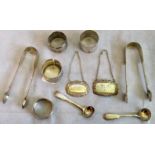 A mixed lot of small silver items, including three napkin rings, two pairs of sugar nips,