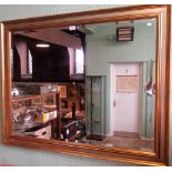 A contemporary gilt framed wall mirror with rectangular bevelled plate.