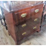 An Edwardian walnut chest, the rectangular top with moulded edge over three graduated long drawers,