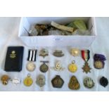 A mixed lot of militaria, including: cap badges, shoulder pips, cloth badges,