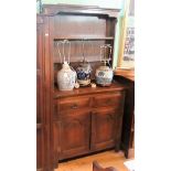 A small reproduction oak tall dresser, the rack with two open shelves,