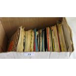 A collection of miscellaneous 45 rpm records,