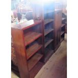 An oak floor standing four tier open bookcase,