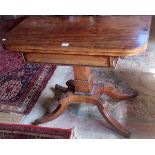 A Regency mahogany card table, the D-shaped fold-over swivel top on a square beaded column,