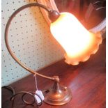 A gilt brass adjustable desk lamp, with opaline frilled glass shade.